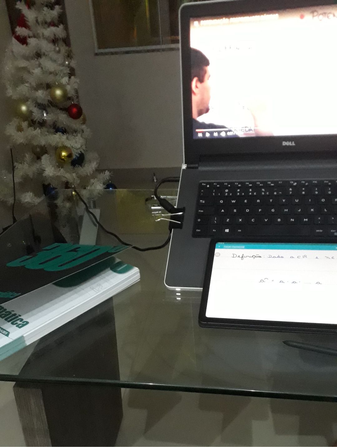 Studying a math video lesson on a tablet